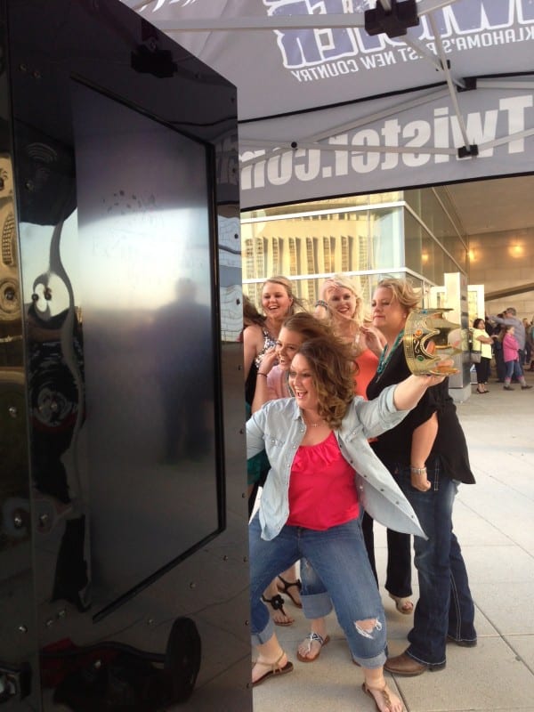 Concert fans enjoying FREE Excellence Photo Booths pictures with 106.1 The Twister at the BOK Center in Tulsa, Oklahoma.