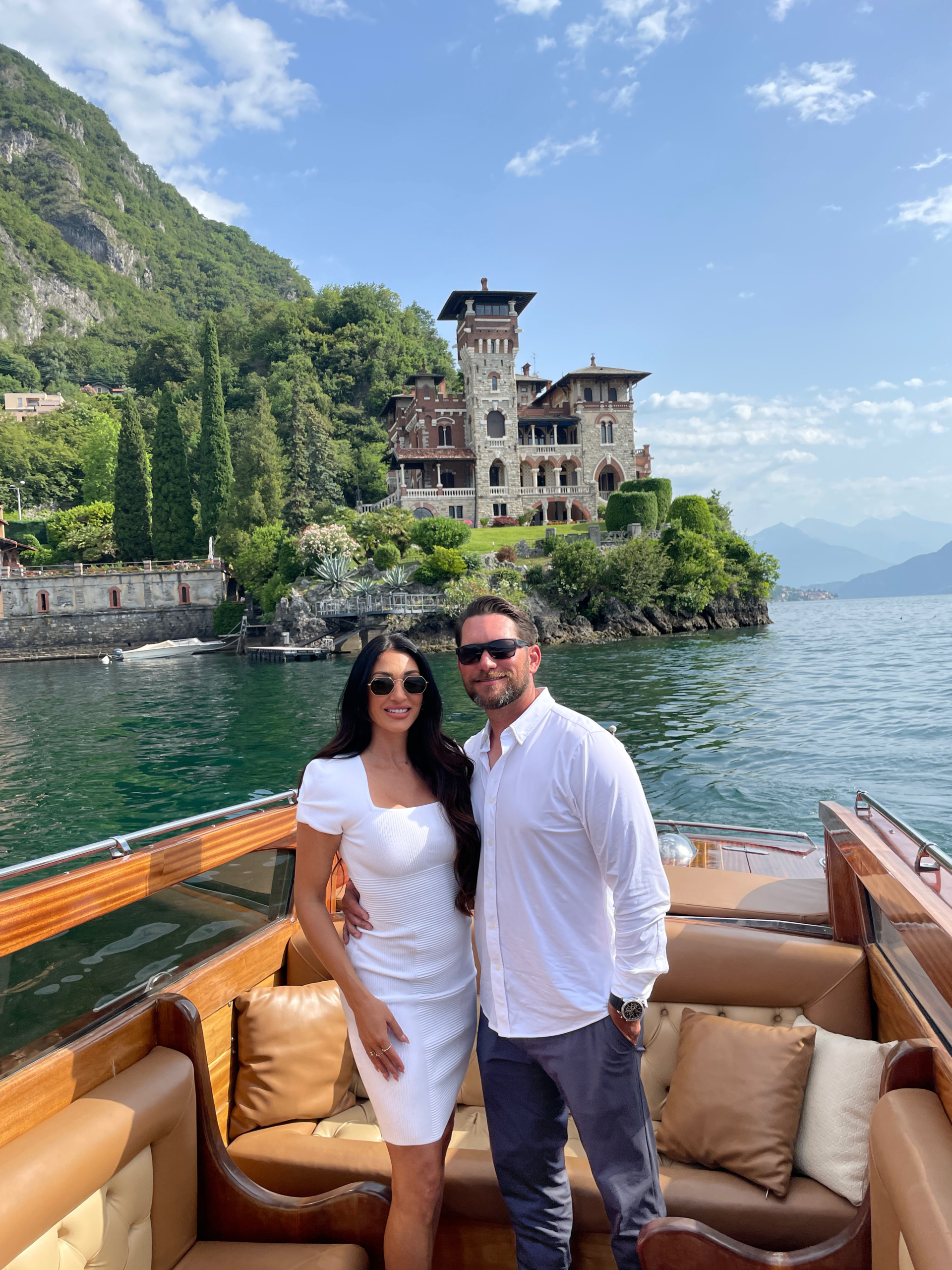 Photograph of Jake and Julia the founders of Excellence Photo Booths taken on a boat on Lake Como
